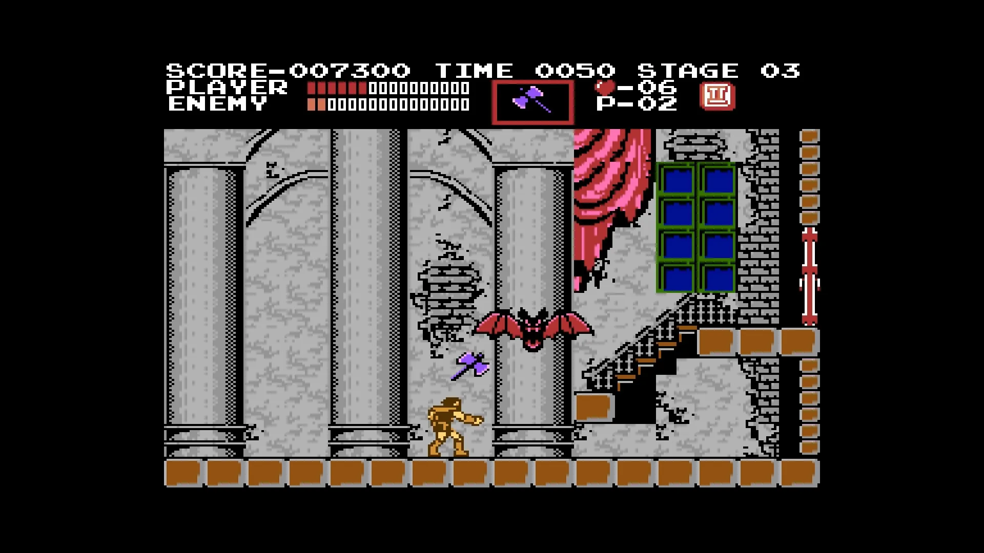 Simon fights a bat in a stone hall in the 1986 Castlevania, Anniversary Collection screenshot